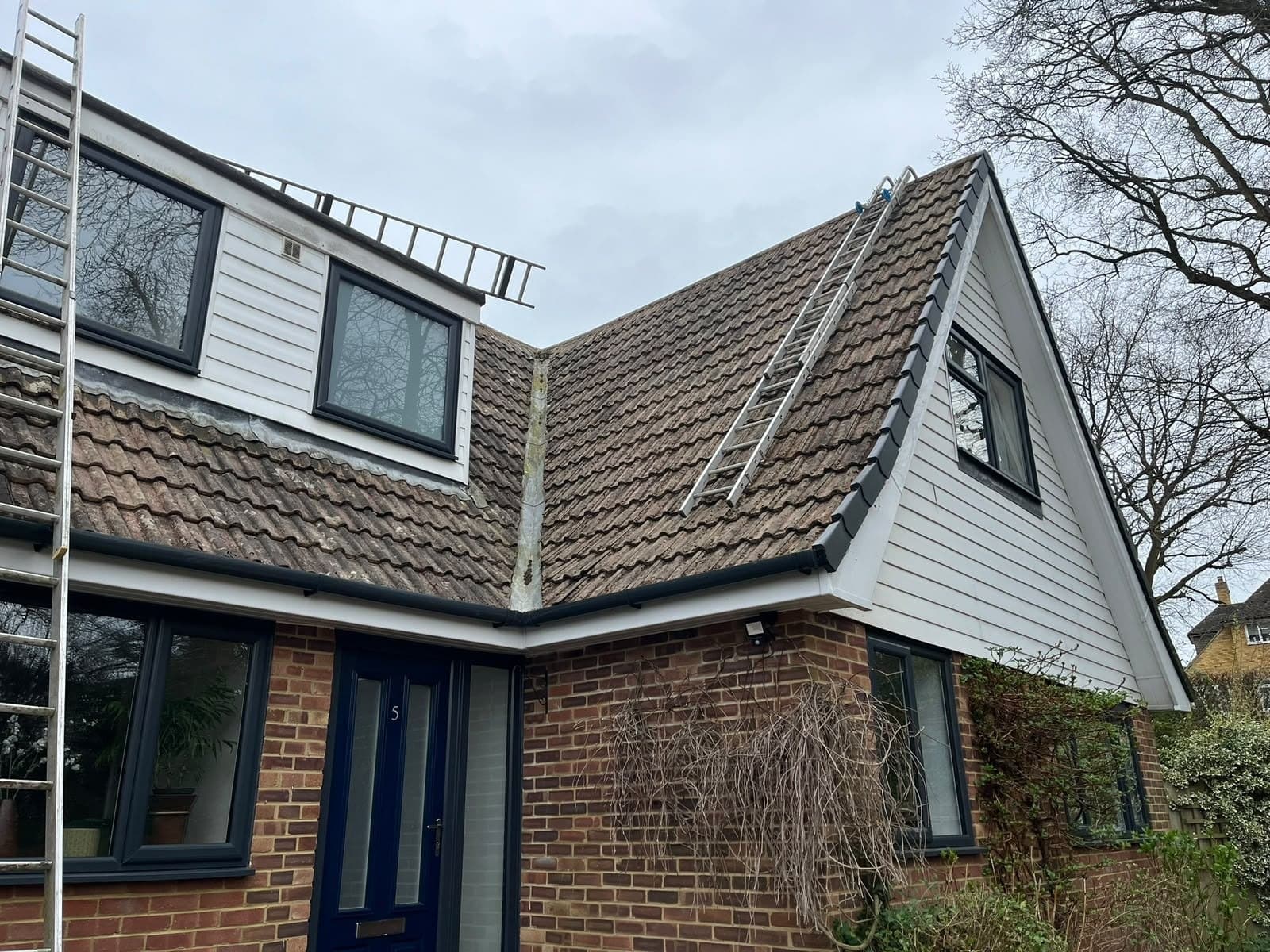 Tiled roof and clad dormer on a finished chalet