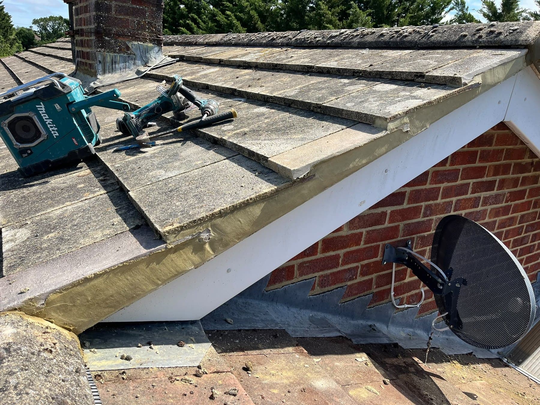 Lead flashing and dry verge with tiles being fixed
