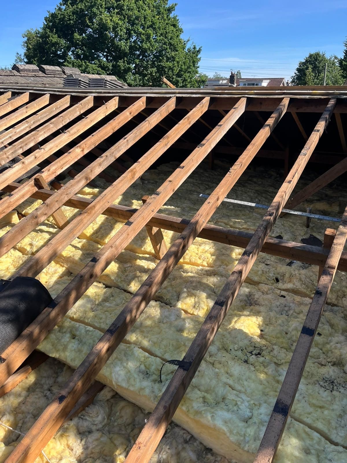 Rafters and insulation exposed