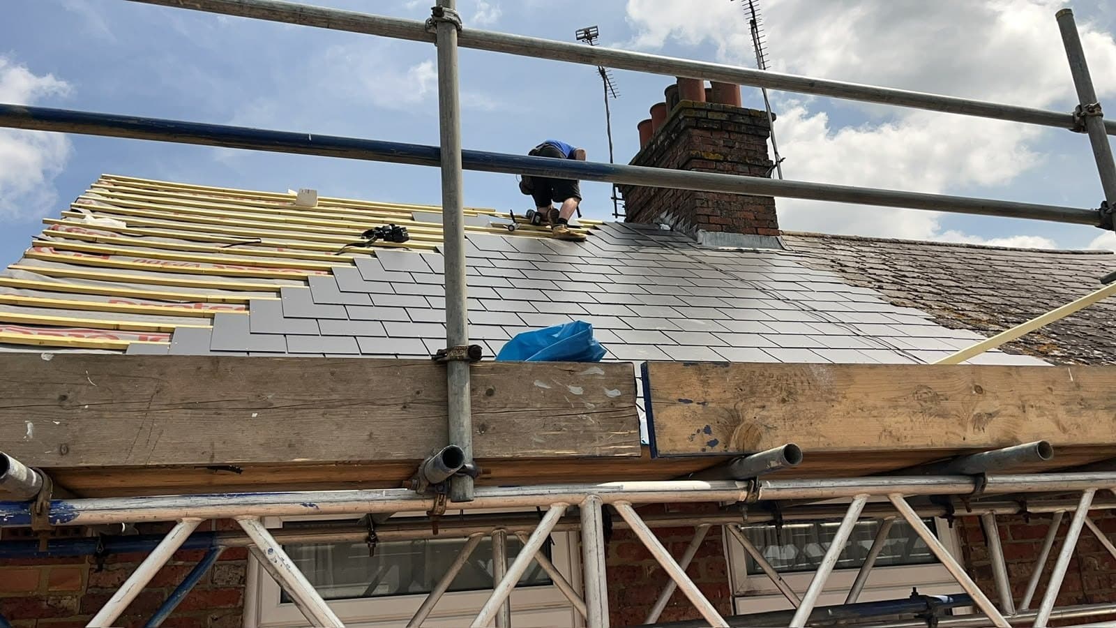 Slating a roof from the scaffold